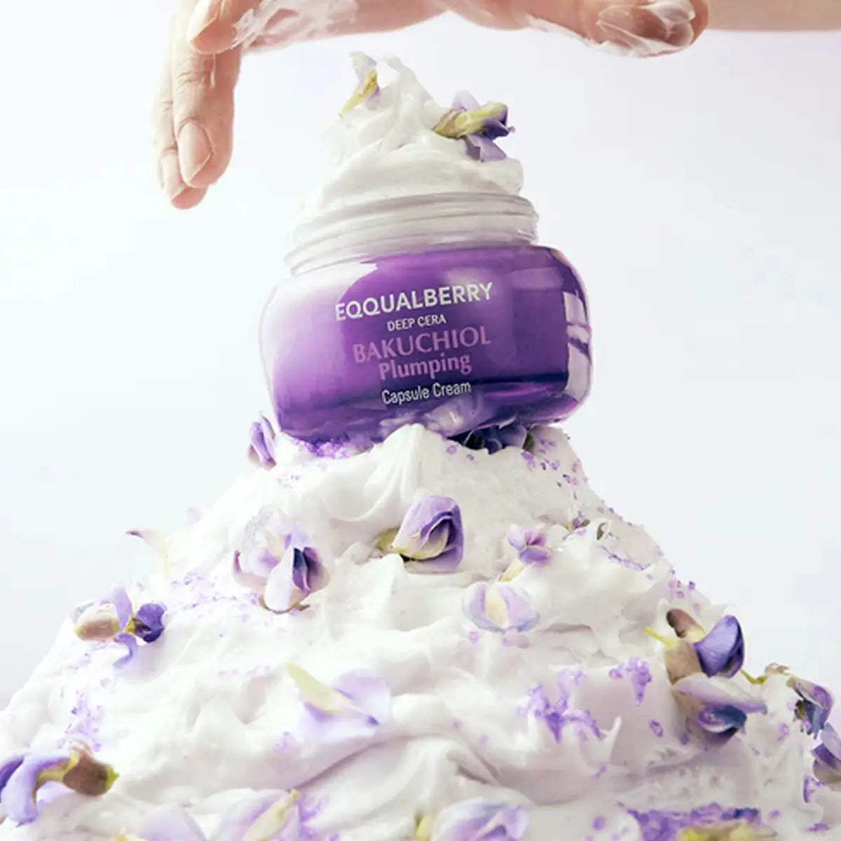 Eqqualberry Bakuchiol Plumping Capsule Cream with floral elements on a white background