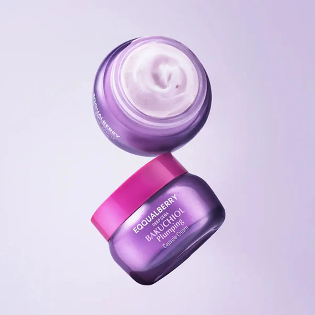 Two jars of Eqqualberry Bakuchiol Plumping Capsule Cream, one open showing white cream, on a light purple background