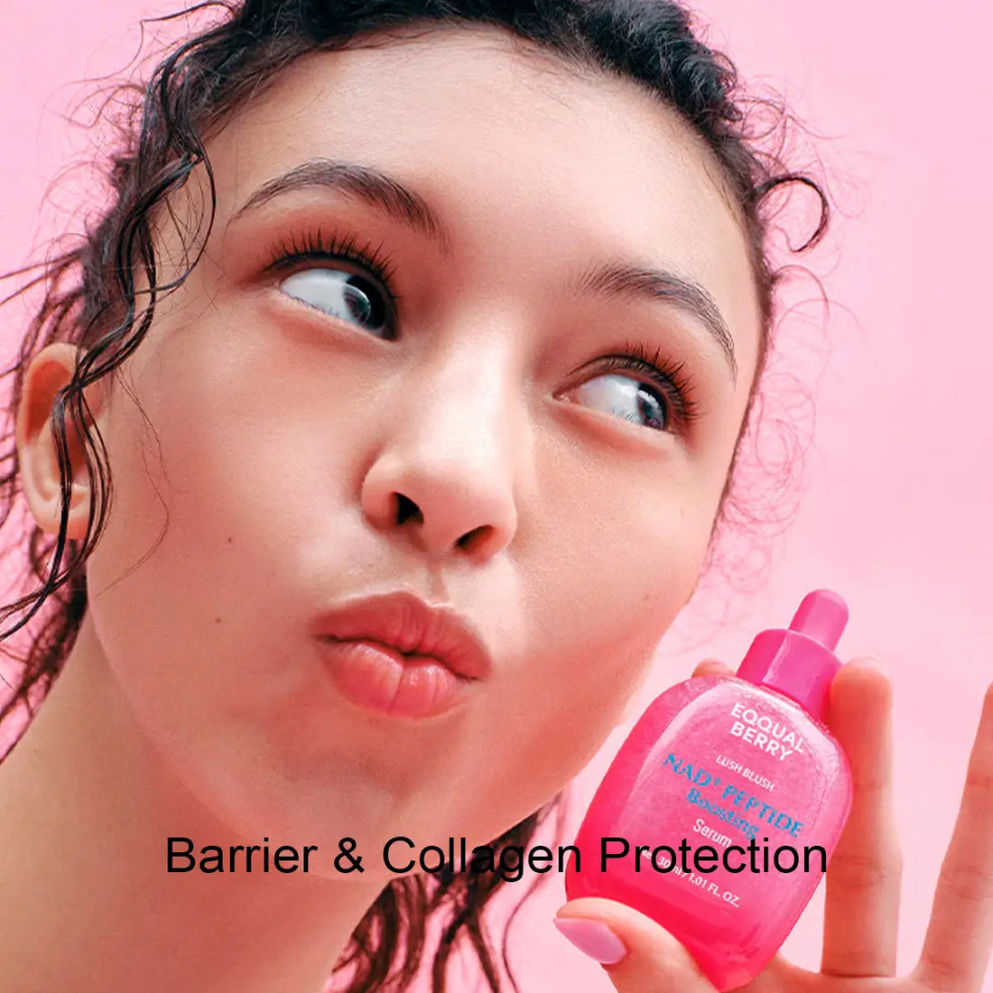 Person holding a Eqqualberry NAD+ Peptide Boosting Serum bottle with a pink background
