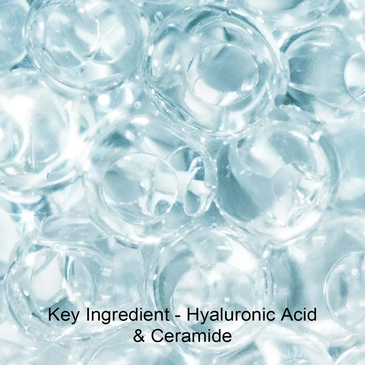 Close-up of hyaluronic acid and ceramide gel beads with text overlay.