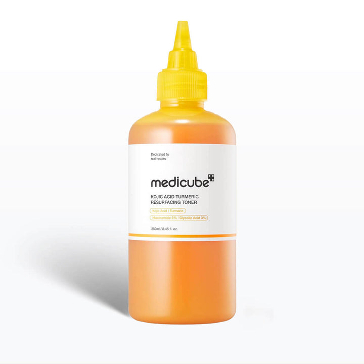 Kojic Acid Turmeric Resurfacing Toner bottle from Medicube, 250mL, bright orange liquid in a squeeze bottle.