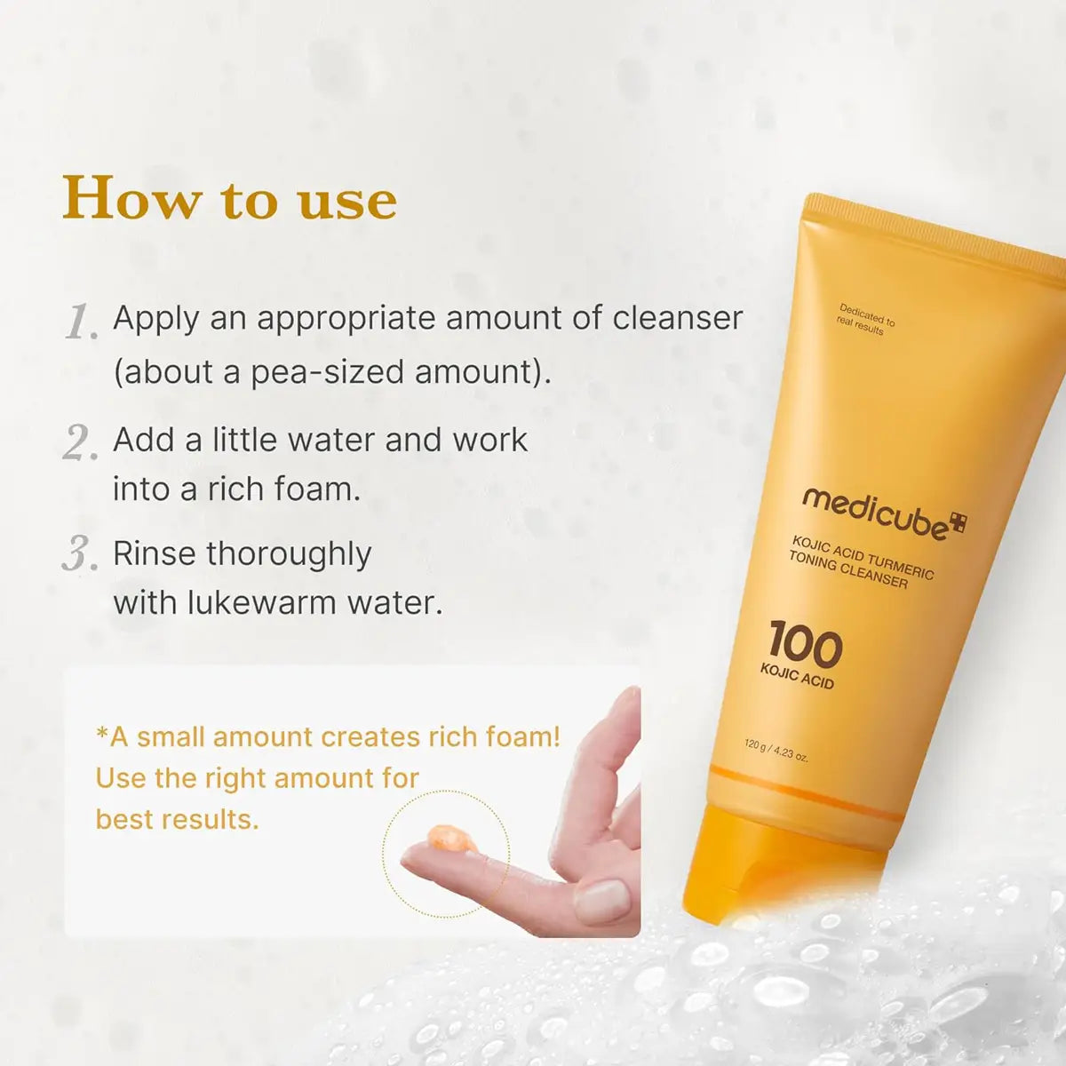 Yellow tube of Medicube cleanser with instructions on how to use it on a white background.